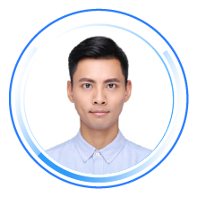 Professional portrait profile photo of an individual in a blue collared shirt, centered in a circular blue graphic frame.