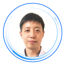Portrait profile photo of an individual in a circular blue frame, facing forward against a plain background.
